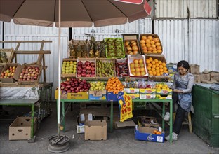 Fruit stall, woman selling fruit at the Osh bazaar, Bishkek, Kyrgyzstan, Asia