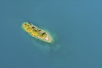 Bird's eye view of the chive island in the turquoise waters of Lake Walen in the canton of St.