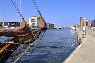 Maritime everyday and tourist scene and cityscape at the Old Harbour in the Old Town, Hanseatic