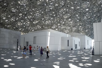 Visitors in the light rain of the Louvre Abu Dhabi, architect Jean Nouvel, Saadiyat Island, Abu