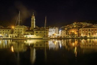 Church of St. Jerome of Stridon and sailboats at night, Pucišca, Split-Dalmatia County, Croatia,