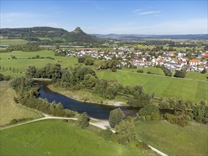 The Radolfzeller Aach with the village of Hausen an der Aach, on the horizon the Hegau volcano