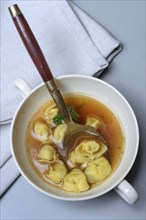 Cappelletti, pasta with broth in shell, pasta