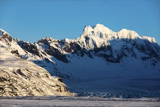 Snowy mountain peaks of Skaftafellsfjöll, in front the glacier of Skeidararjökull, near Skaftafell,