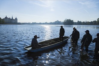 Fishing of the castle pond in Moritzburg