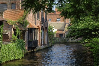 Canal between old houses of famous Flemish medieval city Brugge. Bruges, Belgium, Europe