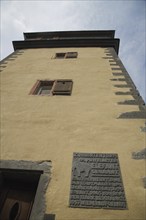 Historic cowherd's defence tower the elephant with view upwards and information board, fortified