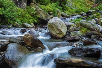 Cascade of tropical waterfall in Himalayas. Bhagsu, Himachal Pradesh, India. Polarizer filter used