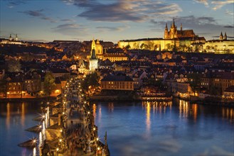 Night view of Prague castle and Charles Bridge over Vltava river in Prague, Czech Republic. Prague,