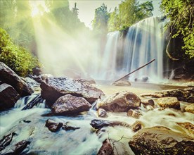 Vintage retro effect filtered hipster style image of tropical waterfall Phnom Kulen, Cambodia, Asia