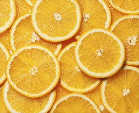 Colorful orange citrus fruit slices background top view