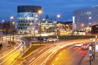 Evening city traffic in Essen, Germany, large intersection, roundabout, Berliner Platz, Berlin