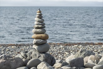 Concept of balance and harmony, pile of stones, beach, sea, Iceland, Europe