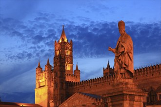 In the old town of Palermo, statue of the saint in front of the Cathedral Maria Santissima Assunta,