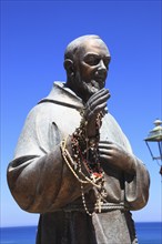 Castellammare del Golfo, statue of Padre Pio of Pietrelcina with prayer chains on his right hand,