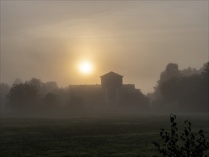 Brewery and brewery tower in the morning mist, sunrise, haze, Schlepzig, Spreewald, Brandenburg,