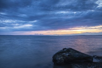 Blue hour at Lake Constance, clouds, water, shore, dead wood, summer, Langenargen,