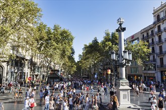 Crowd in summer, pedestrians and tourists in pedestrian zone La Rambla, Ramblas, old town,