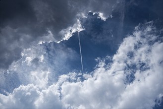 Contrails above the clouds, Bavaria, Germany, Europe