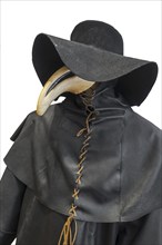 Black wide-brimmed hat, overcoat and beaked mask for plague doctor to treat victims of bubonic