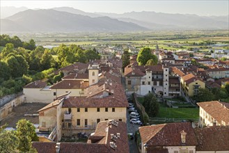 View of the Alps from the Torre Civica over Casa Cavassa, Saluzzo, Province of Cuneo, Piedmont,