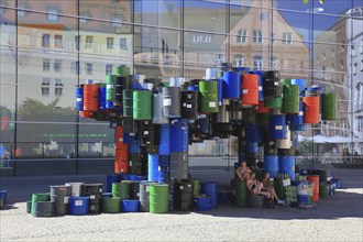 In the historic centre of Nuremberg, art with barrels in front of the Neues Museum Nuremberg, State