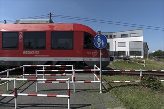 Suburban railway crossing an ungated pedestrian crossing, Eckental Middle Franconia, Bavaria,