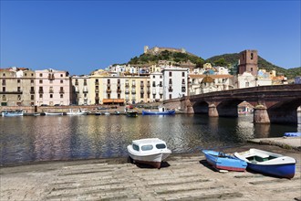 View over the Temo river to houses and the Malaspina castle, old town centre of Bosa, Oristano,