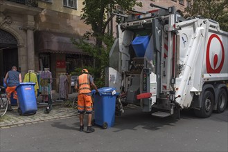 Emptying the blue paper bins by a private environmental service, Nuremberg, Middle Franconia,