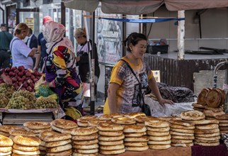 Woman selling bread, stall, Osh bazaar, Bishkek, Kyrgyzstan, Asia