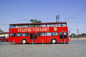 Numerous companies offer city tours in Dresden with a wide variety of vehicles, here the red