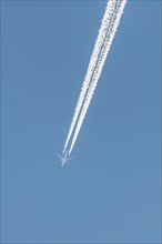 Airliners in flight in a blue sky in late summer. France