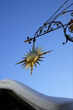 Sun as an inn sign, Alps, Andermatt, Switzerland, Europe