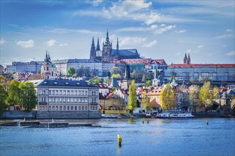 View of Gradchany Prague Castle and St. Vitus Cathedral in daytime over Vltava river