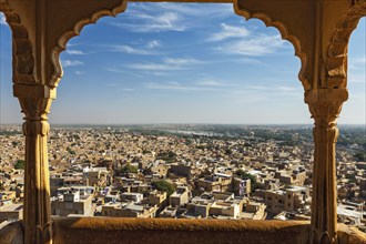 View of Jaisalmer city from Jaisalmer fort through arch. Jaisalmer, Rajasthan, India, Asia