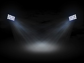 Stadium theater floolights spotlights with light beams on black background