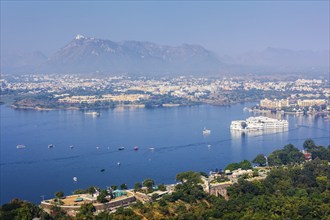 Aerial view of Lake Pichola with Lake Palace (Jag Niwas) and Udaipur city. Udaipur, Rajasthan,