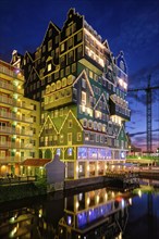 ZAANDAM, NETHERLANDS, MAY 21, 2018: Inntel Hotel in Zaandam illuminated at night. Design of