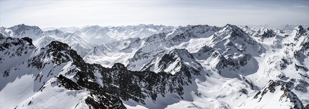 View of snow-covered mountain panorama, view from Sulzkogel, in the back summit Gamskogel and