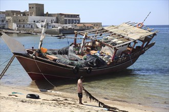 Dhow in the old fishing harbour of Mirbat in the south of Oman