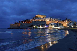 Old town with the Romanesque castle from the 14th century, blue hour, Peñíscola, province