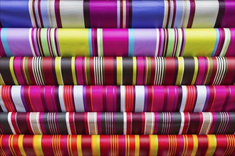 Colourful striped paper, various sheets of wrapping paper in typical stripes, close-up, background