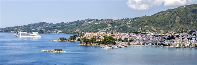 Skiathos town with cruise ship holiday by the sea panorama on the Mediterranean island of Skiathos,