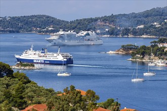 Cruise ship ferry and boats in the sea off the Mediterranean island of Skiathos, Greece, Europe