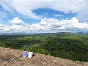 Men sitting on rocks, view of the landscape, Pidurangala, Sri Lanka, Asia