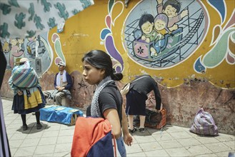 Passers-by in front of the entrance to the Sagrado Corazon de Jesus school, Avenida Ferrocarril,