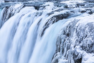 Godafoss waterfall, icy and snowy rock face, Northern Iceland Eyestra, Iceland, Europe