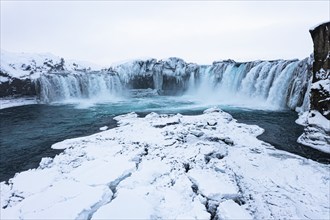 Godafoss waterfall, snowy landscape, drone shot, Northern Iceland Eyestra, Iceland, Europe