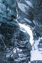 Ice cave open to the top with snow-covered ice combs, Pröng ice cave, Sudurland, Iceland, Europe