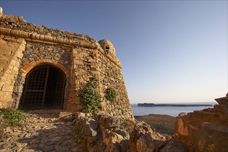 Venetian sea fortress Gramvoussa, morning light, fortress gate, fortress walls, round defence